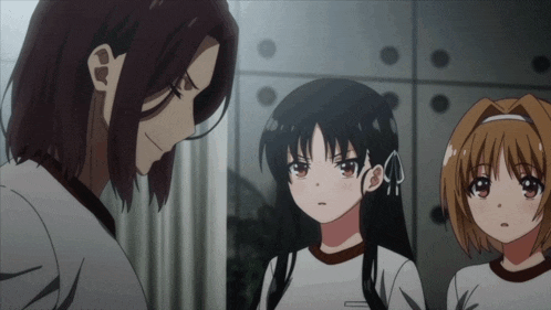 a group of anime girls are standing next to each other and one of them is wearing a white shirt that says ' tokyo '