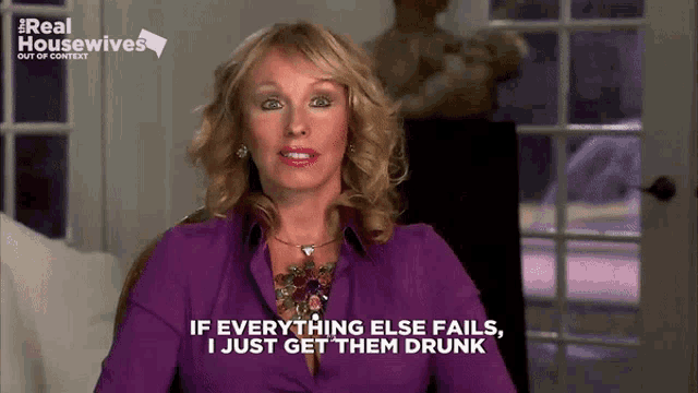 a woman in a purple shirt is talking about getting drunk
