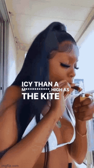 a woman in a bikini is smoking a cigarette with the words icy than a m high as the kite above her