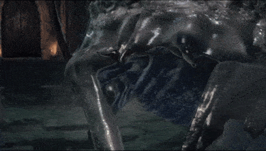 a close up of a person 's torso and legs in a dark room