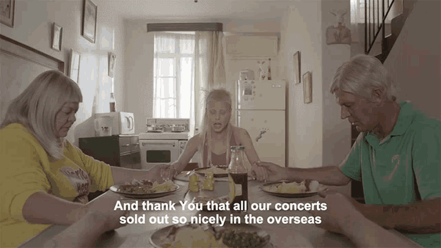 a group of people sitting around a table with the words and thank you that all our concerts sold out so nicely