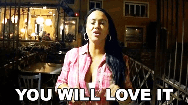 a woman says " you will love it " while standing in front of a restaurant