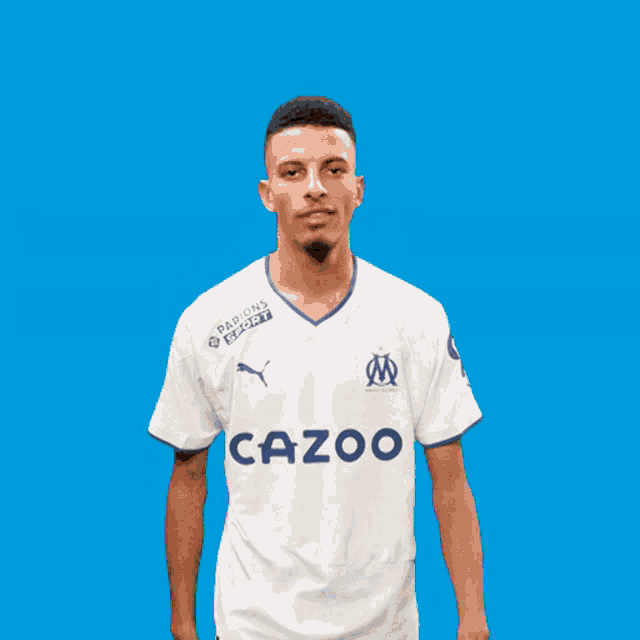 a man wearing a white shirt with cazoo on the front