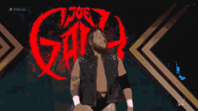 a wrestler is standing in front of a logo that says ' smack down ' on it