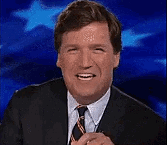 a man in a suit and tie is smiling on a blue background