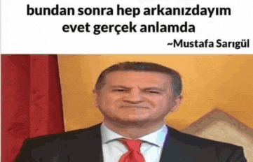 a man in a suit and tie is making a funny face in a meme .
