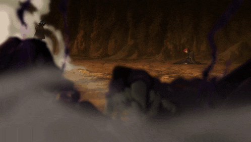 a person laying on the ground in a cave