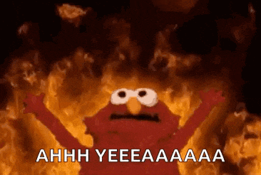 elmo from sesame street is standing in front of a fire and says ahhh yeeeaaa .