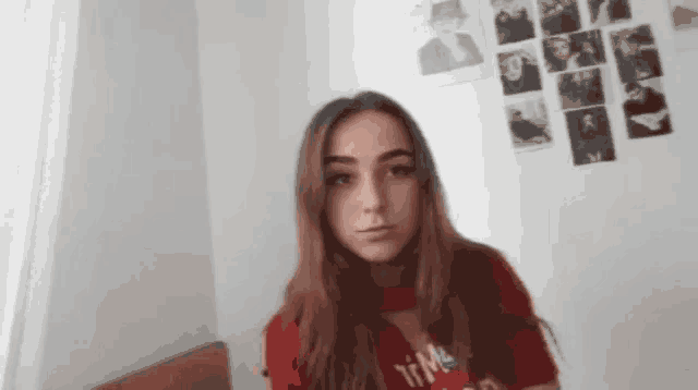 a girl wearing a red shirt with the word time on it