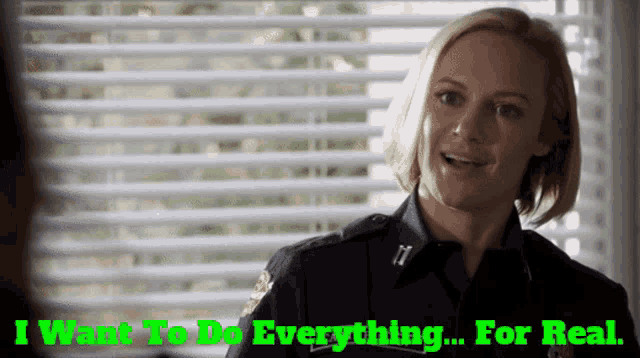 a woman in a police uniform says i want to do everything