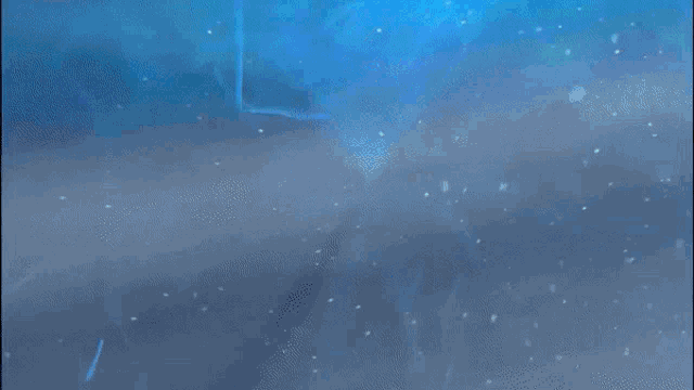 a blue background with a glowing object in the middle of it