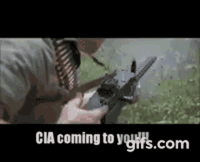 a man is holding a gun with the words cia coming to you gifs.com