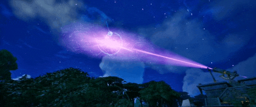 a purple laser beam is being thrown in the sky