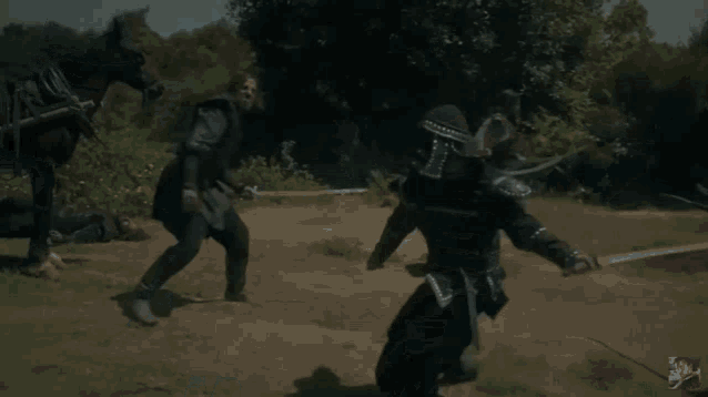 a man with a sword is fighting another man with a horse