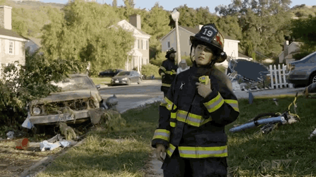 a fireman wearing a helmet that says 19 on it