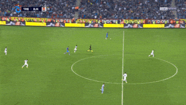 a soccer game between trb and bjk is underway