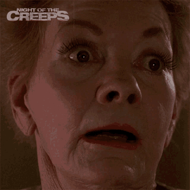 a close up of an older woman 's face with night of the creeps written on the bottom