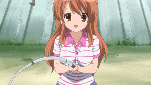 a girl in a striped shirt is holding a hula hoop