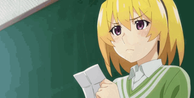 a girl with yellow hair and pink eyes is holding a piece of paper in front of a green board