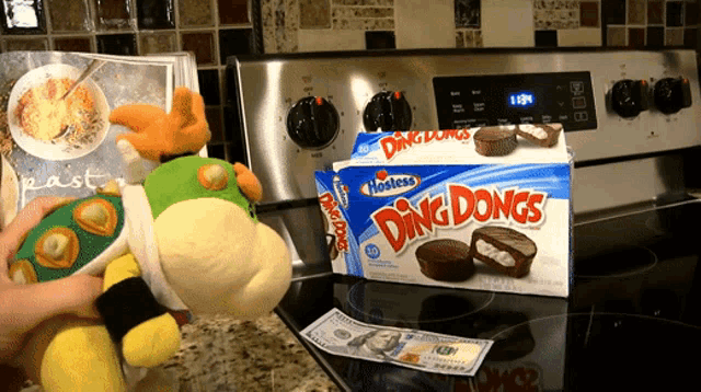 a box of hostess ding dongs sits on the stove