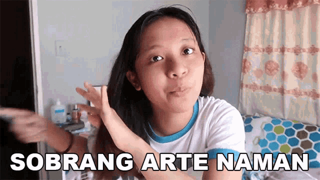 a girl with the words sobrang arte naman written on her face