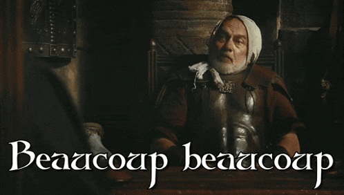 a man sitting in a chair with the words beaacoup beaacoup c'est trop written below him
