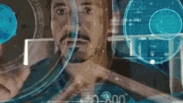 a man with a beard is looking at a screen with a circle on it .