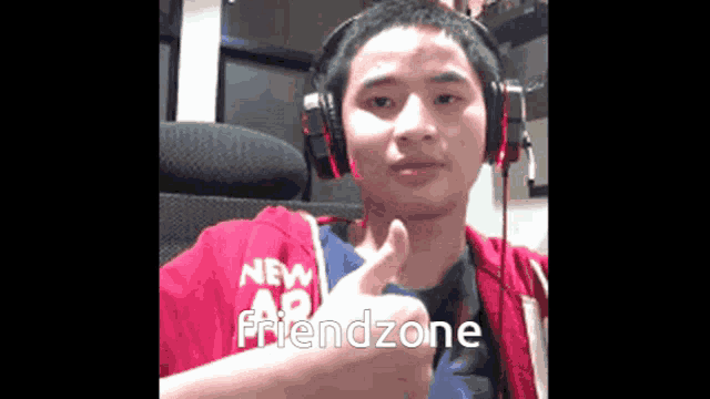 a young man wearing headphones is giving a thumbs up and the word friendzone is on the bottom right