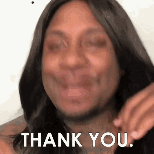 a woman with long hair is making a funny face and saying thank you .