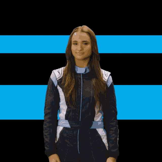 a woman in a race suit stands in front of a black and blue background with the name emily ren on it
