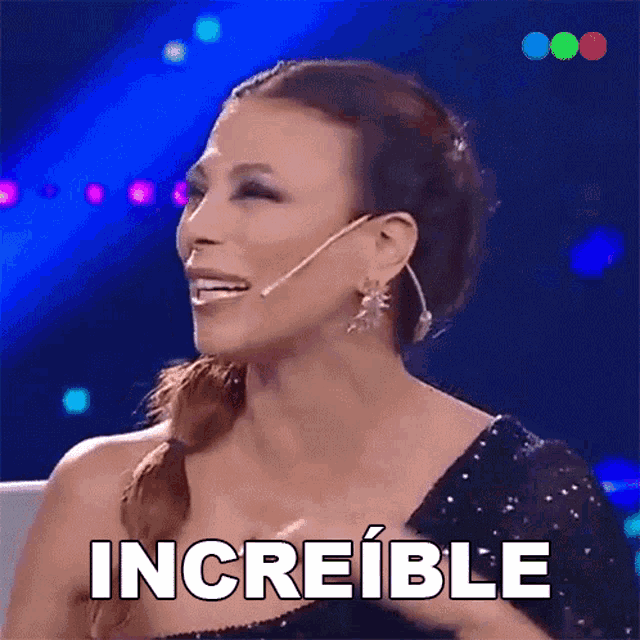 a woman with a microphone in her ear is smiling and the word increible is above her