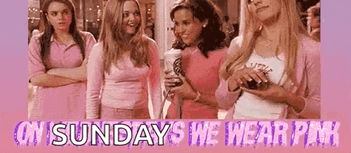 a group of women are standing next to each other in pink .