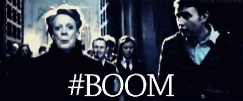 a group of people are walking down a street and the word boom is visible
