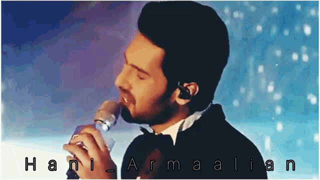 a man in a tuxedo is singing into a microphone with the name hani armalian written on the bottom