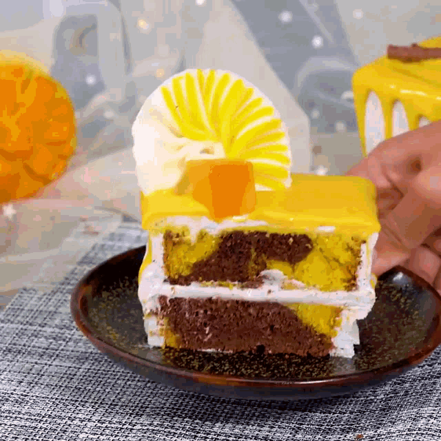 a slice of cake on a plate with a yellow frosting