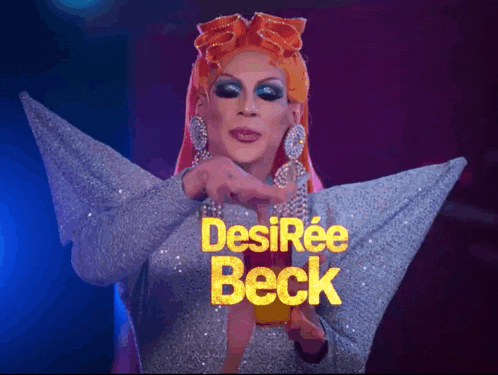a drag queen named desirée beck is wearing a silver top