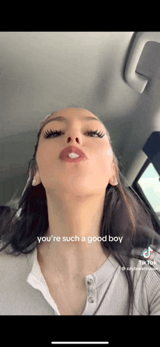 a woman in a car with a caption that says you 're such a good boy on it