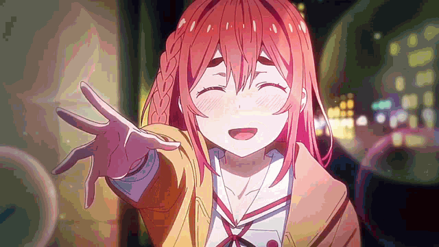 a girl with red hair is smiling with her eyes closed