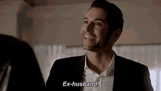 a man in a suit says " ex-husband " in front of another man