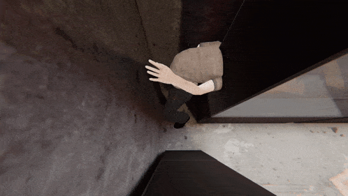 a person standing in a corner of a room with their hand on the wall