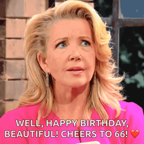 a blonde woman in a pink shirt says " well happy birthday beautiful cheers to 66 "