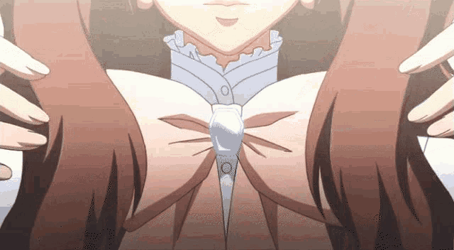 a close up of a girl 's breasts with a bow on it