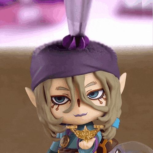 a close up of a figurine with a purple headband