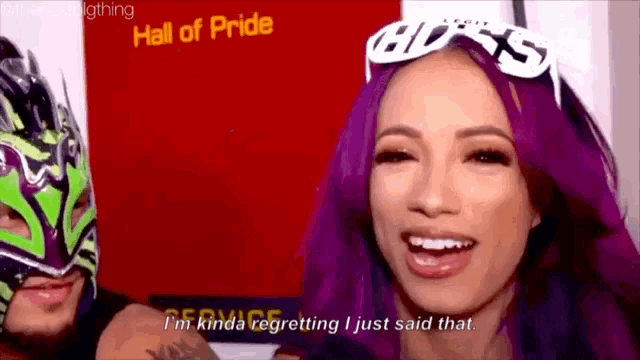 a woman with purple hair says i 'm kinda regretting i just said that ..