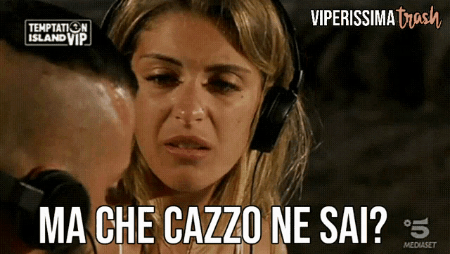 a woman wearing headphones with the words ma che cazzo ne sai on the bottom