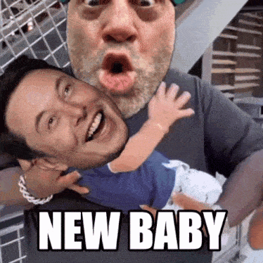 a picture of a man holding a baby with the words new baby below it