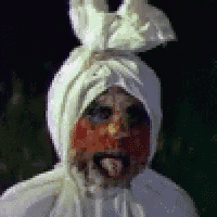 a pixelated image of a person with blood on their face and tongue sticking out