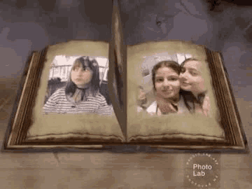 a book is open to a page with two pictures of two girls in it .