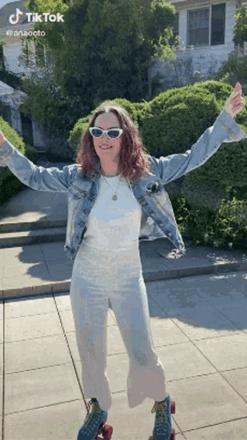 a woman is wearing roller skates and a denim jacket