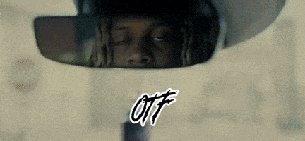 a man is looking at himself in a rear view mirror with the word ott written on it